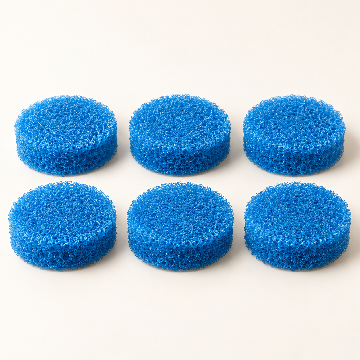 Illustration of six blue scrubber refill pads